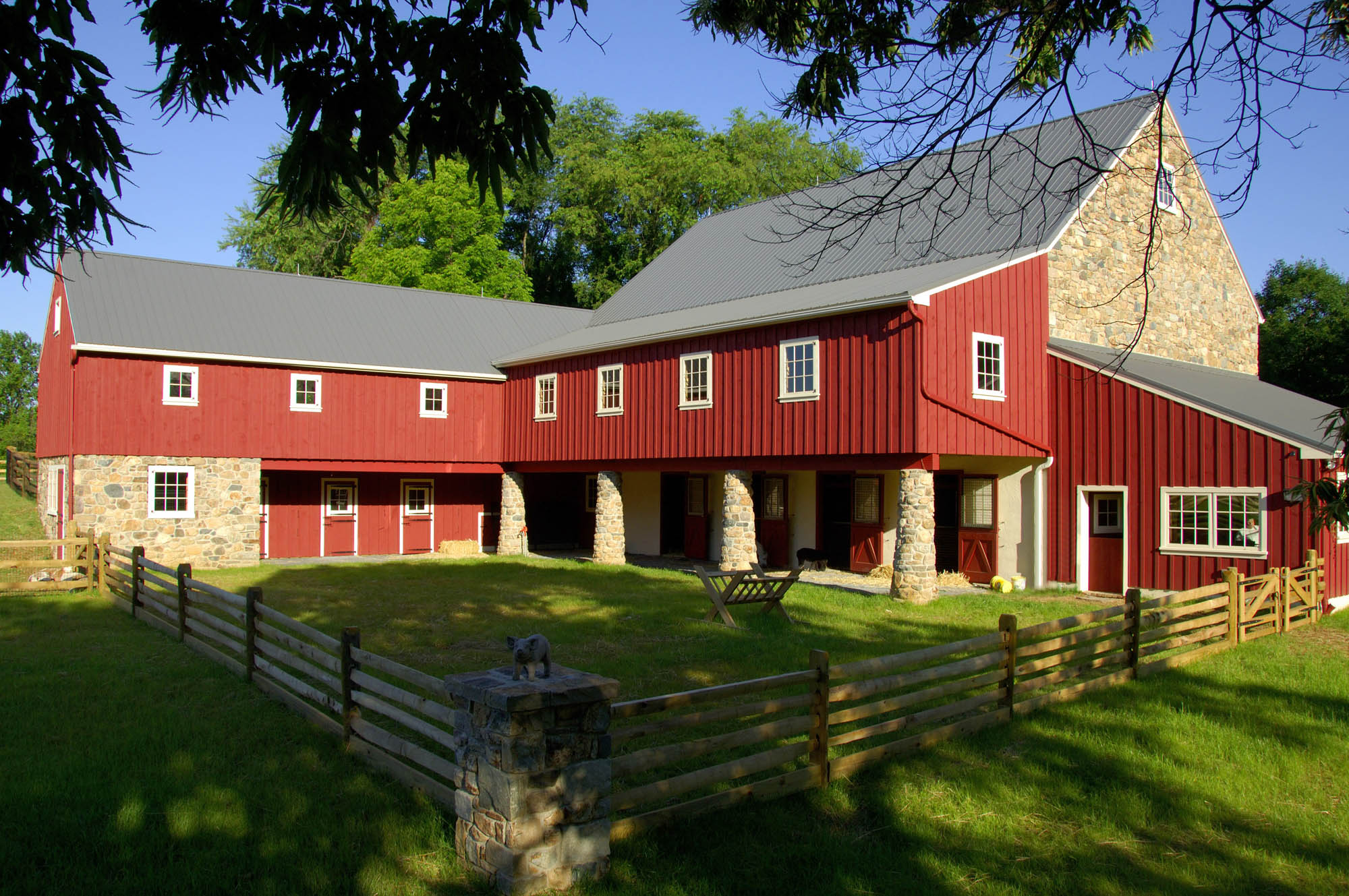 SITED ON A 17-ACRE FARM, this classic Chester County red bank barn was buil...