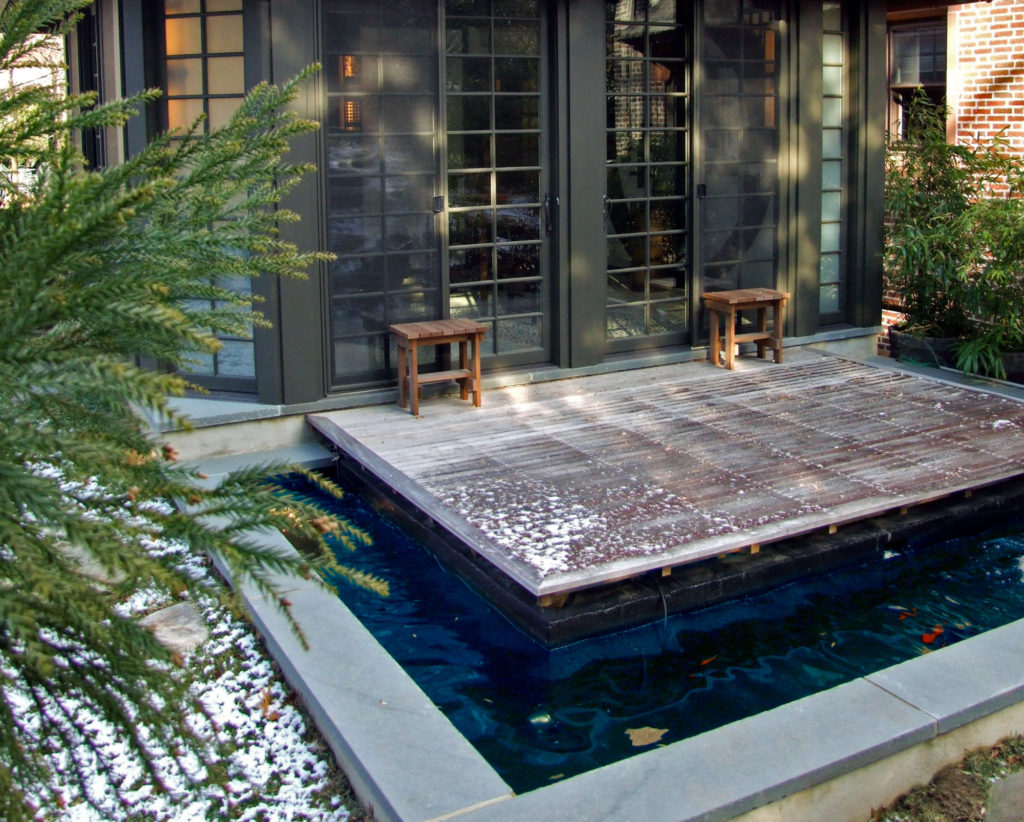 koi pond water feature in outdoor space