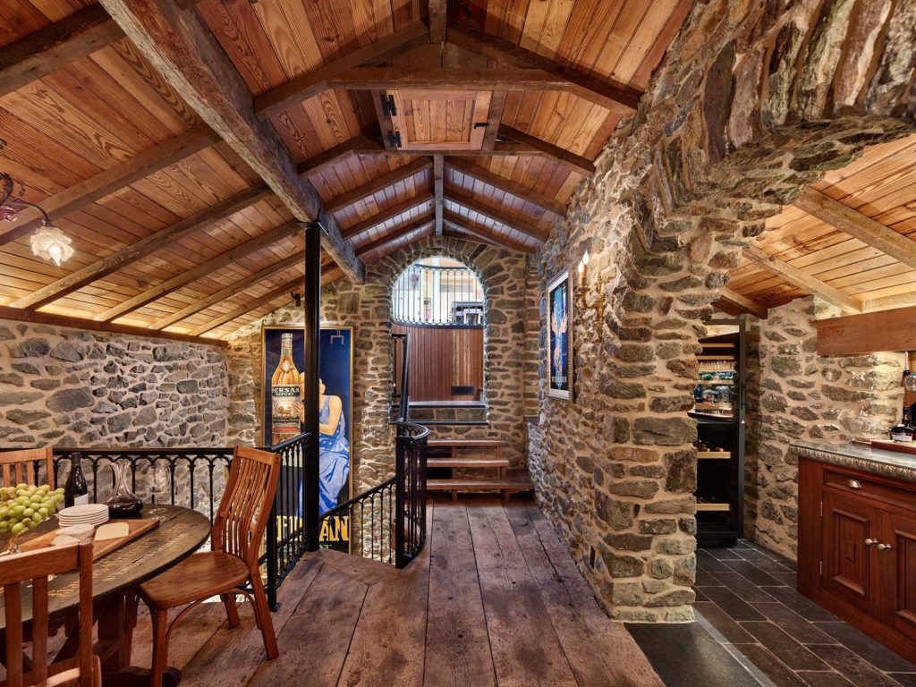 upper level of wine cellar with bar and entertaining area