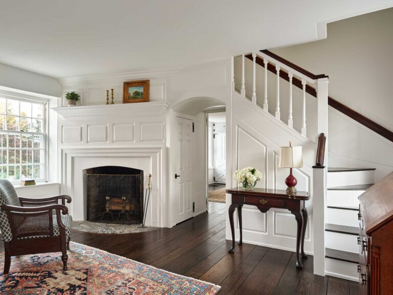 view of fireplace, stair and millwork designed by Brognard Okie in Dower House