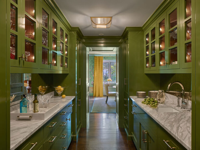 green butlers pantry with marble countertops in renovation of 1950s colonial revival home