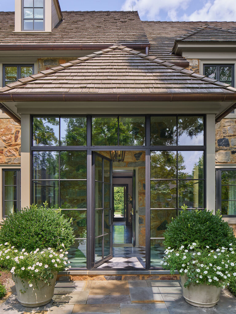 glass and steel enclosed portico