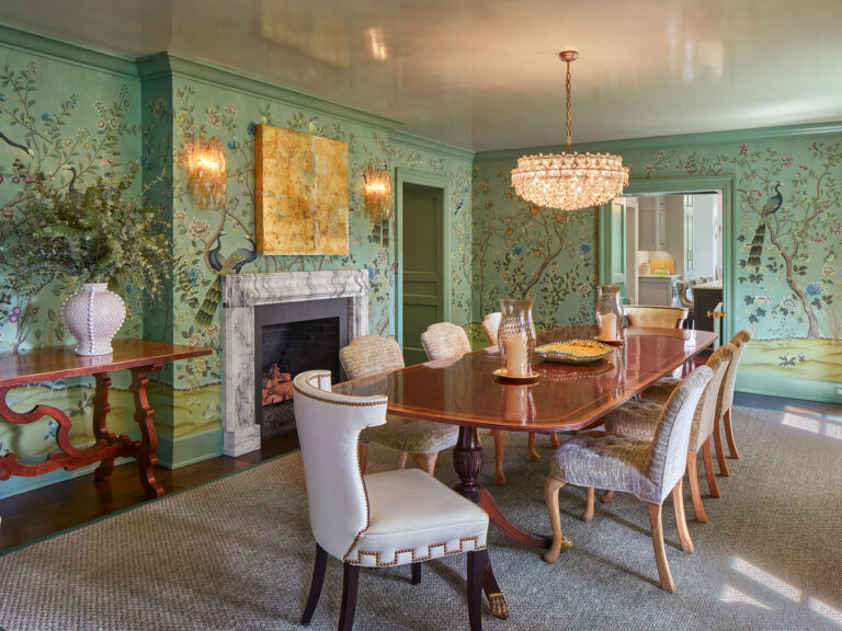 dining room with ornate green wallpaper, chandelier, fireplace and high gloss plaster ceiling in 1950s colonial home renovation