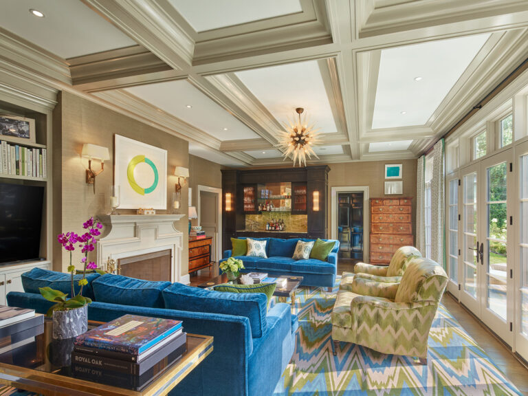 family room with coffered ceiling and french doors opening to terrace