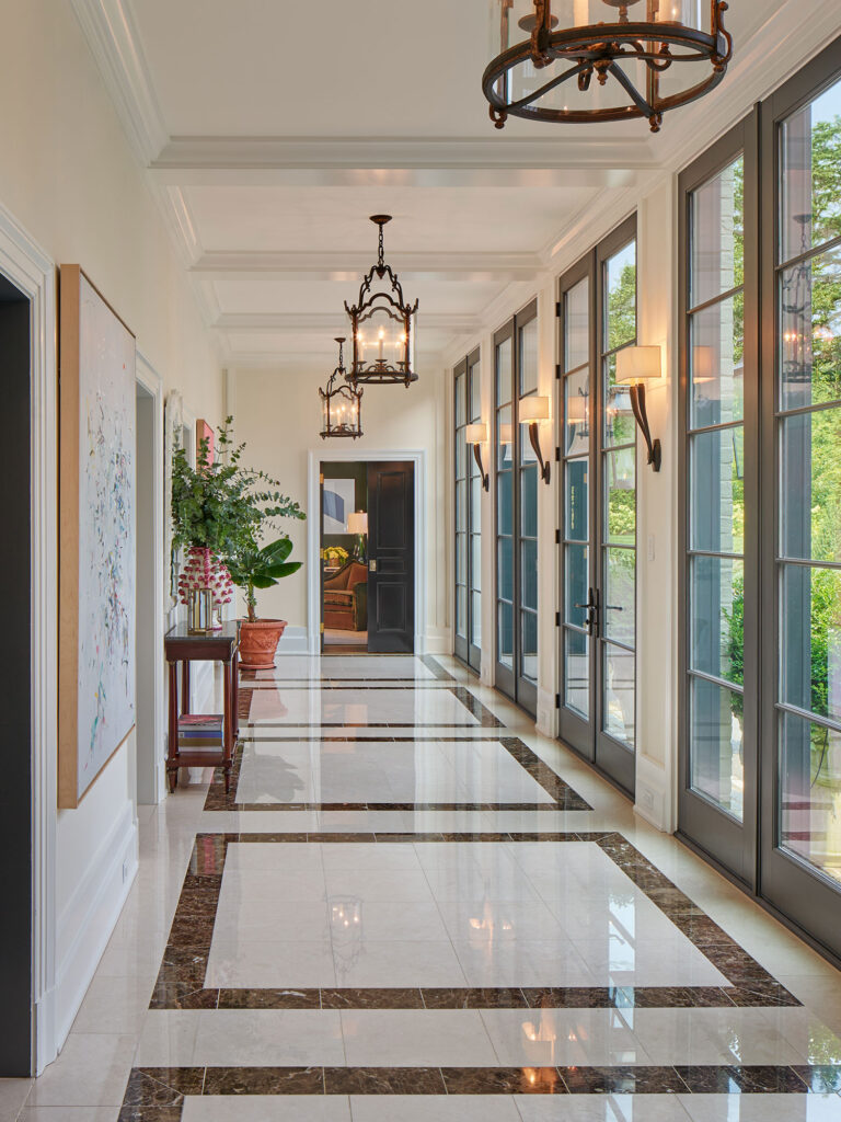 loggia addition serving as connector in renovation of 1950s colonial revival home