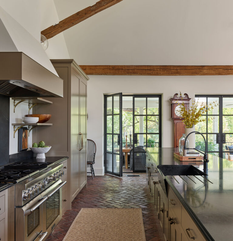 Kitchen with brick floor in great room of Strand Millas in Rockland Delaware